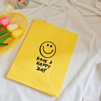 26cm Height Coated Yellow Paper Gift Bags Reusable With Smile Face